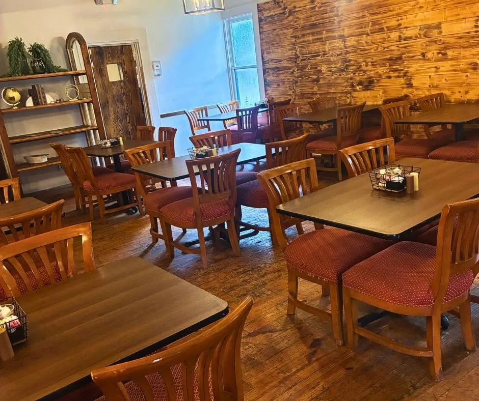 Warm wood dining room with tables and chairs
