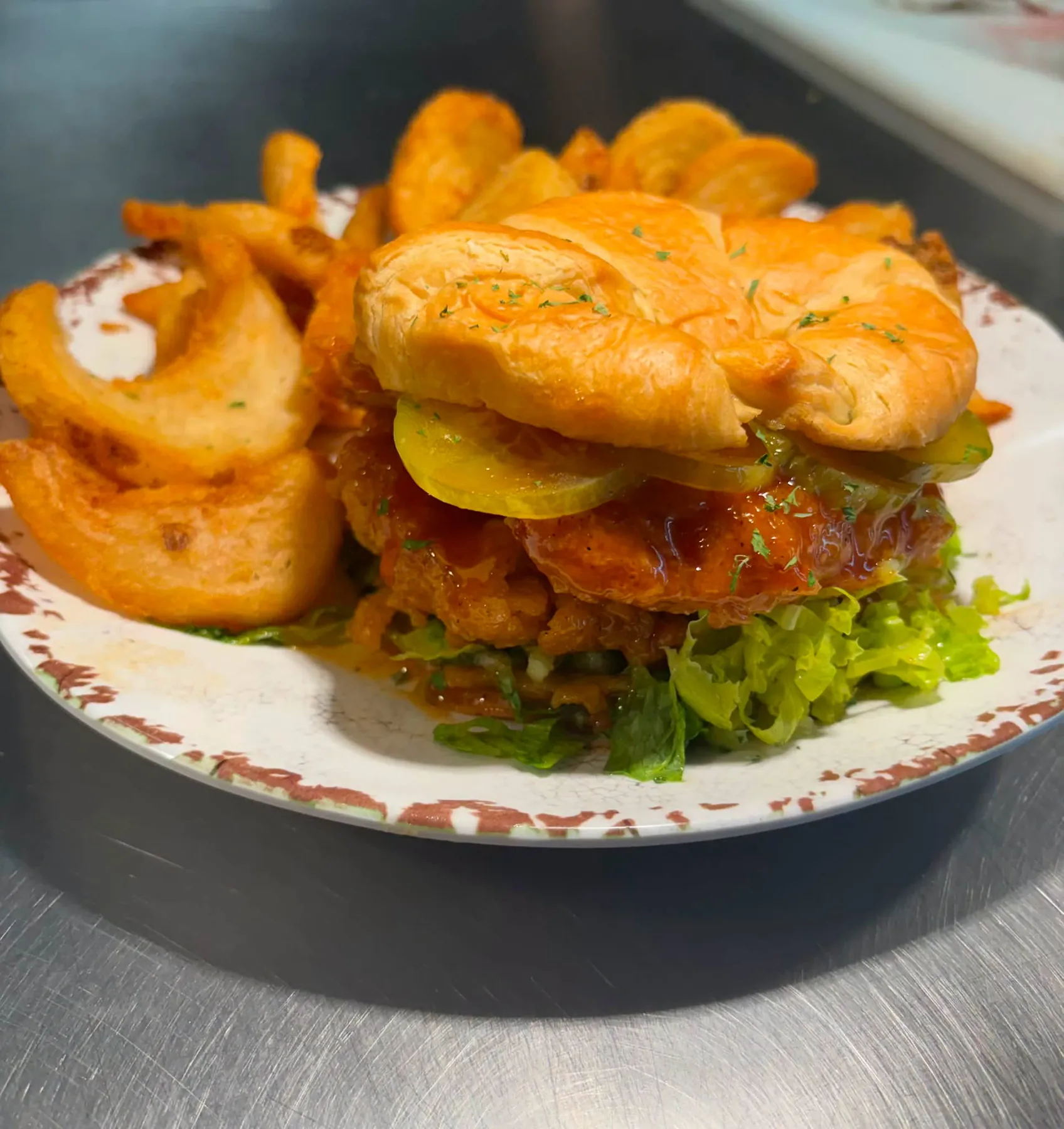 Crispy fried chicken sandwich with fries